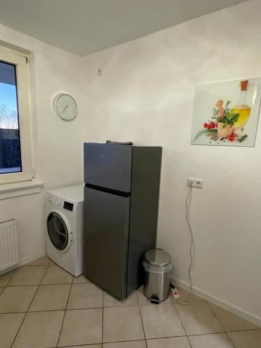 a kitchen with a refrigerator and a washing machine at 40L Luisenstr. 4.OG in Castrop-Rauxel