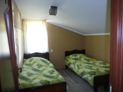 Postel nebo postele na pokoji v ubytování Ushguli Panorama Guest House