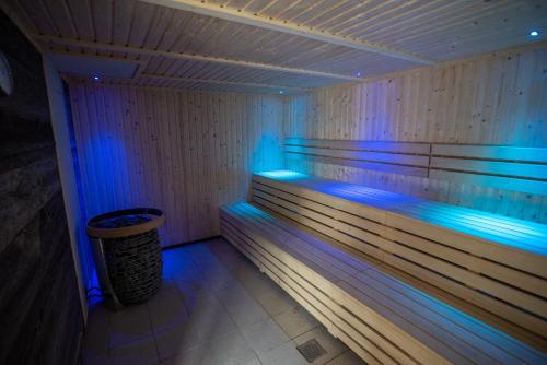 a sauna with blue lights in a room at Lancaster House Hotel in Lancaster