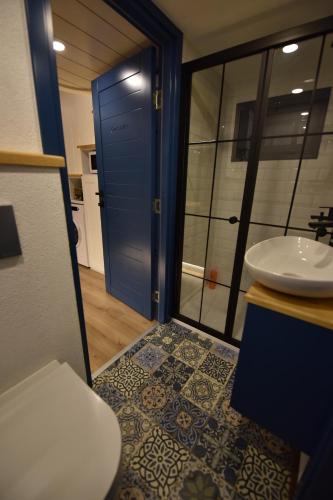 a bathroom with a toilet and a sink at Arkaya TinyHouse in Fethiye