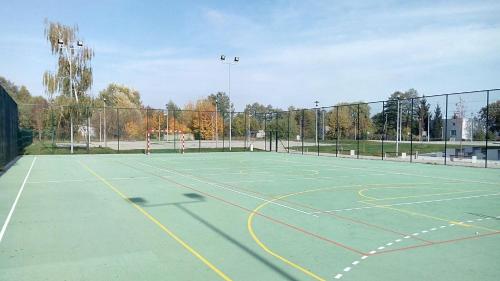 a tennis court with a net on top of it at Hotel Młyn Toruń - dawne MCSM in Toruń