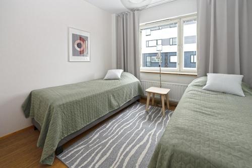 Postel nebo postele na pokoji v ubytování Kuopio in the City