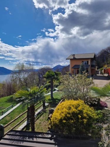 a house with a view of the water and trees at Appartamento Torilla in Trarego
