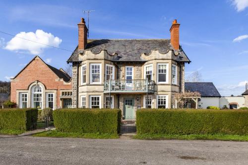 a large house with a balcony on the front of it at The Agents House, Bed & Breakfast in Hereford