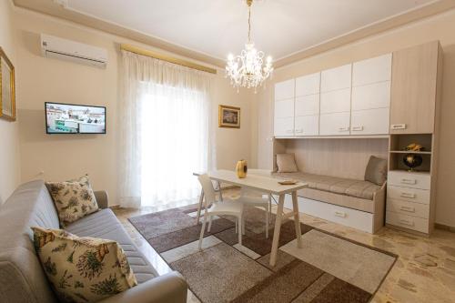 a living room with a couch and a table at Casa Vacanze Kennedy in Favara