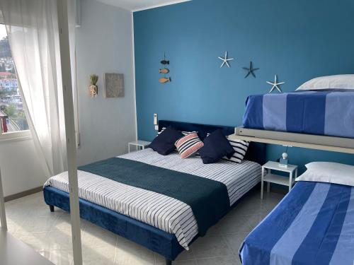 Appartamento Sapore di mare tesisinde bir odada yatak veya yataklar