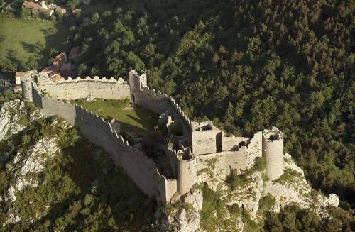an aerial view of a castle on a mountain at Chambre Indépendante Piscine, Parc, Cuisine... in Brézilhac