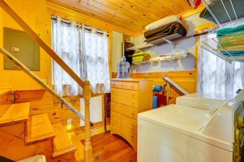 a kitchen with a washer and dryer in a house at Lime Lake Cottage with Lakefront Deck and Dock! 