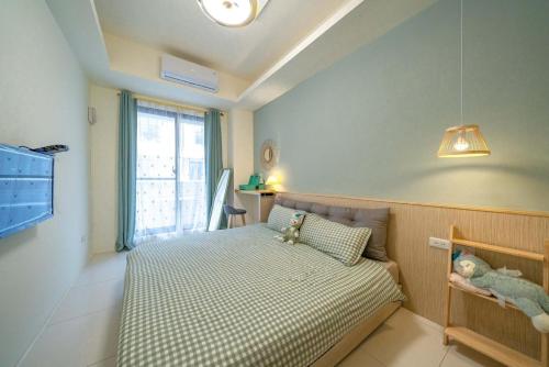 En eller flere senge i et værelse på SKYPIEA Villa 空島民宿