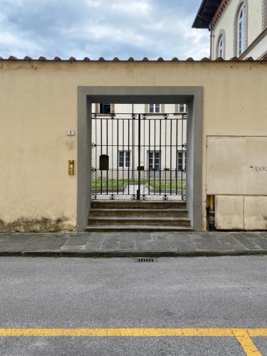 an entrance to a building with a gate at Casa dei Cherubini in Lucca