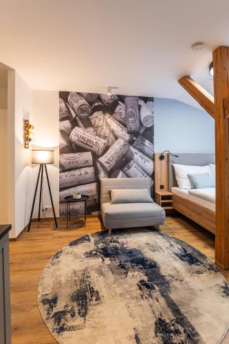 a living room with a bed and a rug at Hotel Restovna in Jíloviště