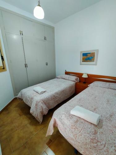 Ένα ή περισσότερα κρεβάτια σε δωμάτιο στο Acogedora casa de pueblo