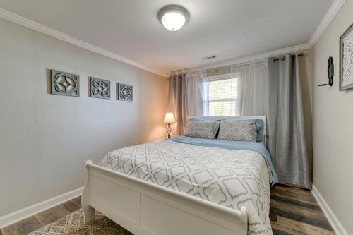 a bedroom with a bed and a window at Pet-Friendly Lexington Vacation Rental on Lake! in Lexington