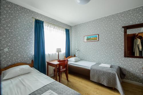 Ein Bett oder Betten in einem Zimmer der Unterkunft Saka Manor