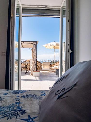 a bedroom with a bed and a view of the ocean at Casa Astra in Anacapri