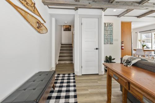 a living room with a bench and a door at Collingwood Chalet Near Blue Mountain Slopes 39B in Collingwood