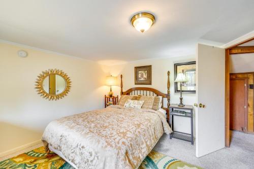 a bedroom with a bed and a mirror at Eureka Springs Vacation Rental Less Than Half-Mi to Dtwn! in Eureka Springs