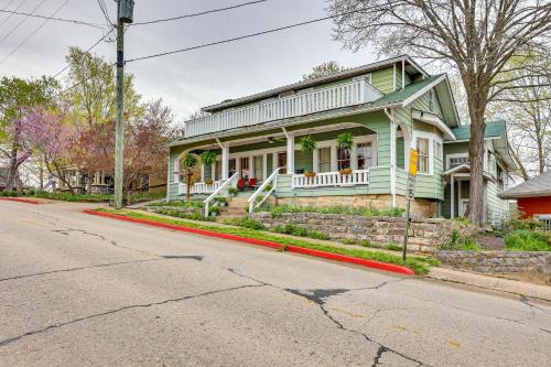 a green house on the side of a street at Eureka Springs Vacation Rental Less Than Half-Mi to Dtwn! in Eureka Springs