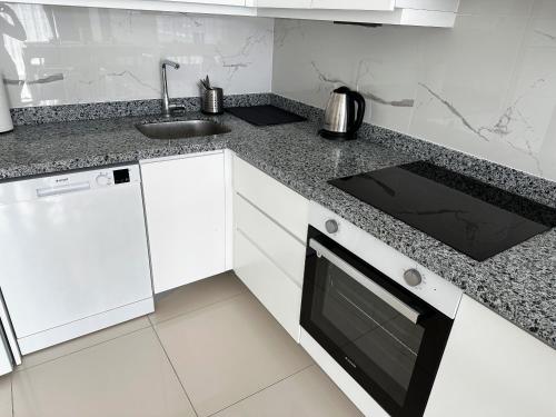 Kuchyň nebo kuchyňský kout v ubytování Apartman Kruna