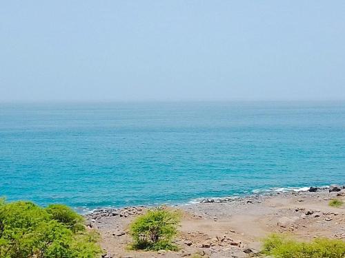 a view of the ocean from a beach at Pousada Cantinho de Preta in Seladinha