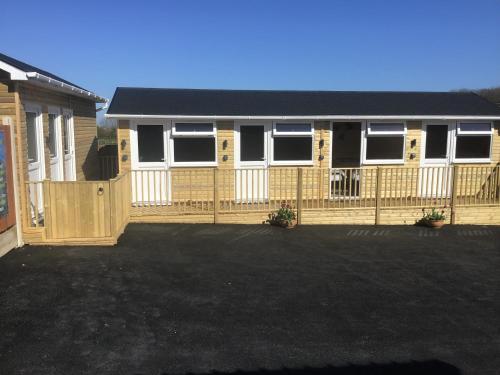 a house with a fence in front of it at Beacon House Bunks in Bridlington