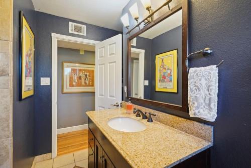 a bathroom with a sink and a mirror at Riverview Huge Yard, Quiet Cul-de-Sac, Perfect for Families in Sacramento