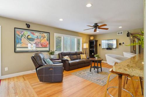 a living room with a couch and a table at Riverview Huge Yard, Quiet Cul-de-Sac, Perfect for Families in Sacramento