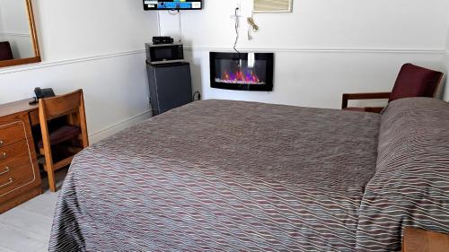 TV a/nebo společenská místnost v ubytování Motel Bonsoir