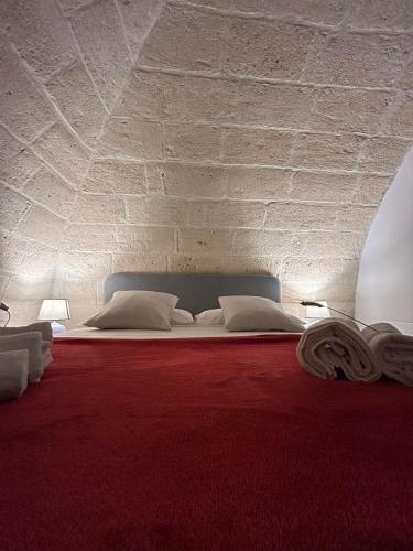 Una cama o camas en una habitación de B&B LE CUSPIDI