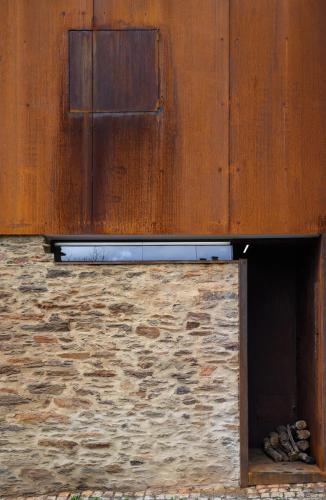 a building with a opening in the side of it at Casa do Ferreiro in Macedo de Cavaleiros