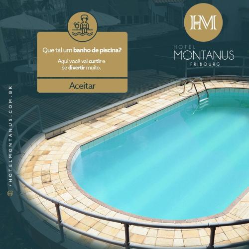 a swimming pool with a sign that reads refermontus jaquetos aquarius at Hotel Montanus in Nova Friburgo