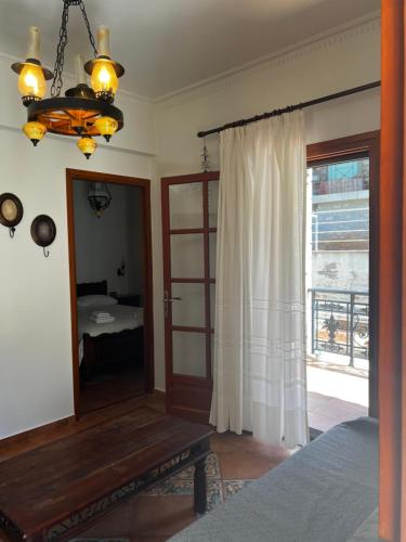 a bedroom with a mirror and a bed and a window at Limeni Studios in Limeni