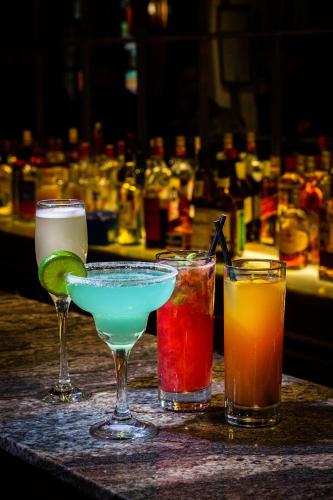 a group of four drinks sitting on a table at Hotel Fundador in Santiago