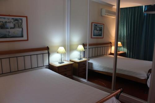 Ліжко або ліжка в номері Apartamentos Varandas da Rocha