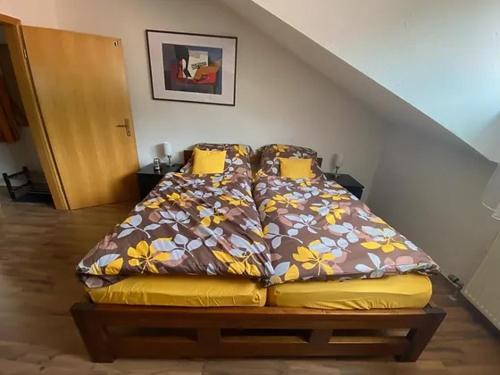 a bed sitting in the corner of a room at Family Apartment Šumava in Bayerisch Eisenstein