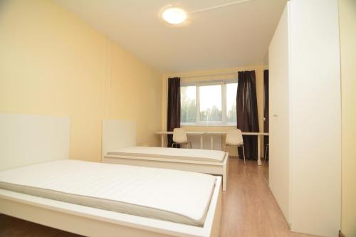 En eller flere senge i et værelse på Pramonės av 77 Kaunas Students Home LT