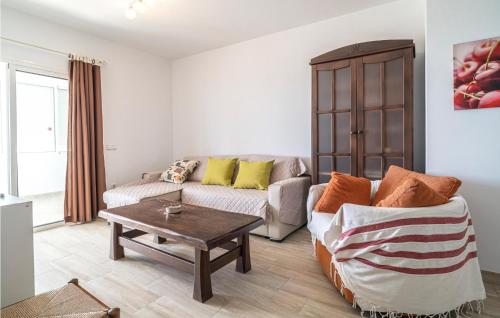 a living room with a couch and a coffee table at Gorgeous Apartment In Malaga With House Sea View in Málaga
