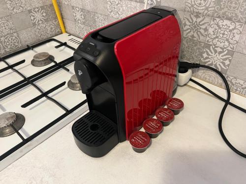 a toaster oven sitting on top of a stove at Belvárosi apartman in Eger