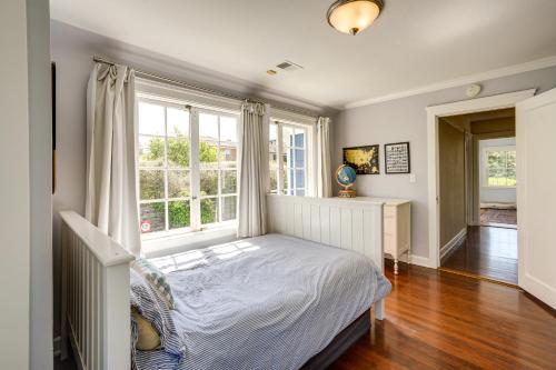 a bedroom with a bed and a large window at Berkeley Home with Garden, Close to San Francisco! in Berkeley