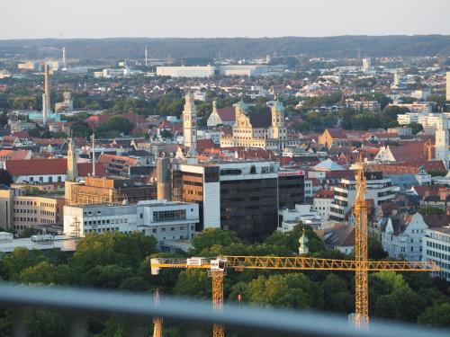 a view of a city with a train on a bridge at Royal - Sky - Suite in Augsburg