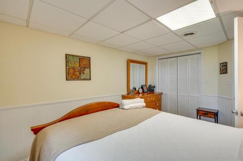 a bedroom with a large white bed and a window at North Carolina Retreat - Deck, Grills and Lake Views in High Point