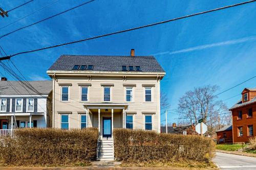 a white house with a gray roof at Sheepscot River Perch in Wiscasset