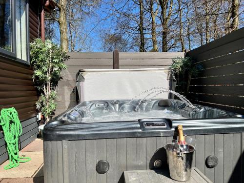 a hot tub in the backyard of a house at Barnston Lodge in Newton on the Moor