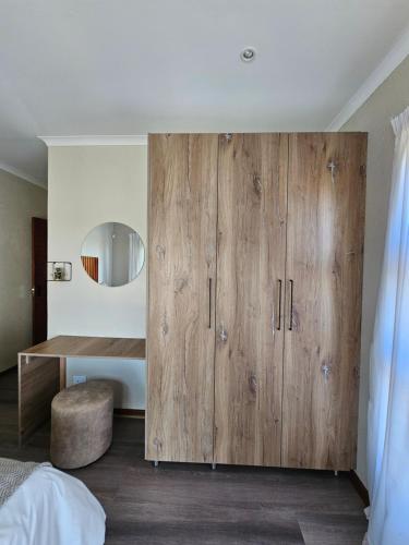 Ένα ή περισσότερα κρεβάτια σε δωμάτιο στο Pine View Guesthouse Graskop