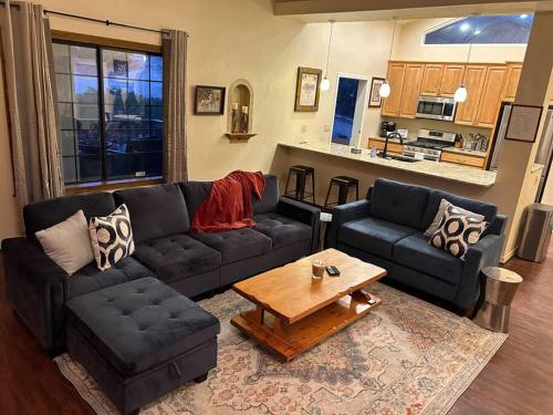 a living room with a couch and a coffee table at Family Friendly Home with Character and Charm in Sedona