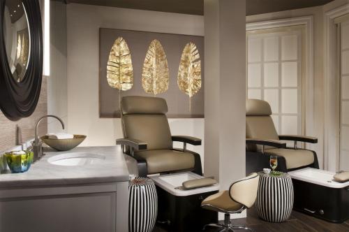 a salon with three massage chairs and a sink at Pier House Resort & Spa in Key West