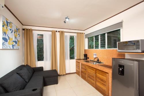 a living room with a couch and a sink at Manzanillo Caribbean Resort in Puerto Viejo