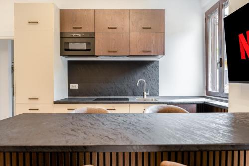 a kitchen with a counter top and a sink at Bilocale Moderno - City Center in Milan