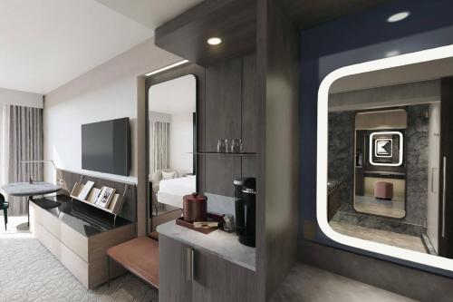 a hotel room with a bed and a fireplace at JW Marriott Charlotte in Charlotte