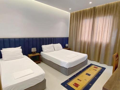 Postel nebo postele na pokoji v ubytování Guesthouse Niko